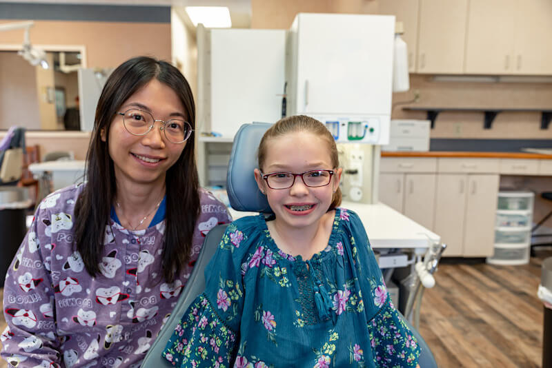 Dr. Tong (alice) Liu smiling with patient