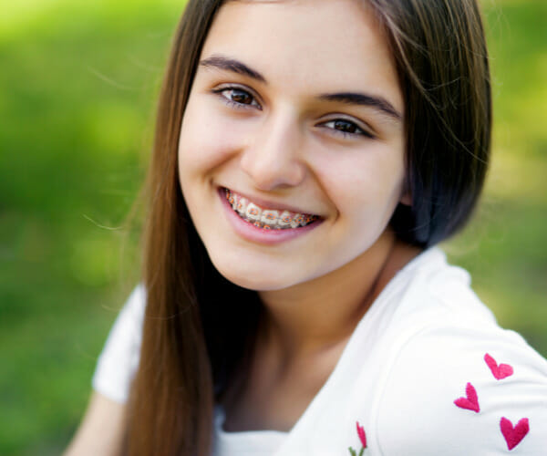 young girl smiling after getting her braces at a kids dentistry in Lufkin
